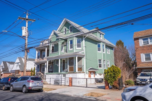 view of front of house featuring fence