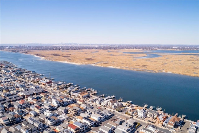 bird's eye view featuring a water view and a residential view