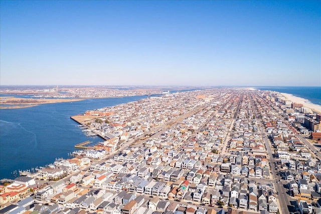 drone / aerial view with a residential view and a water view