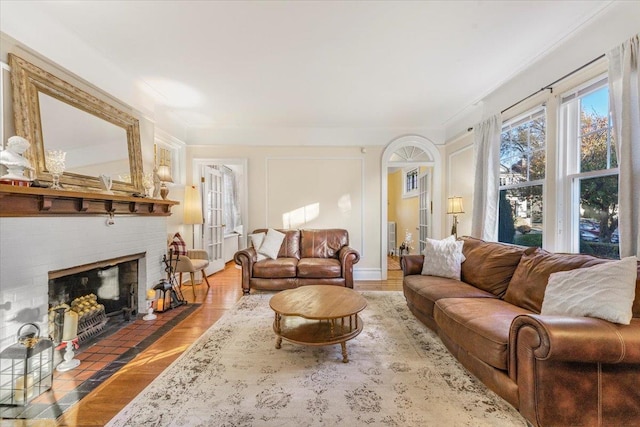 living room featuring wood finished floors and a fireplace