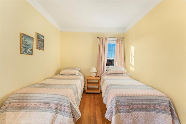 bedroom featuring wood finished floors