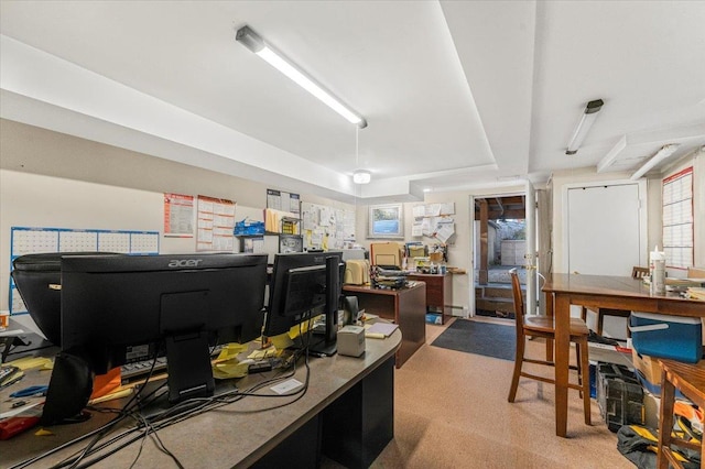 office with a workshop area and a raised ceiling