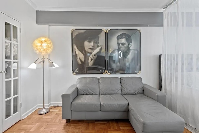 living room featuring crown molding and baseboards