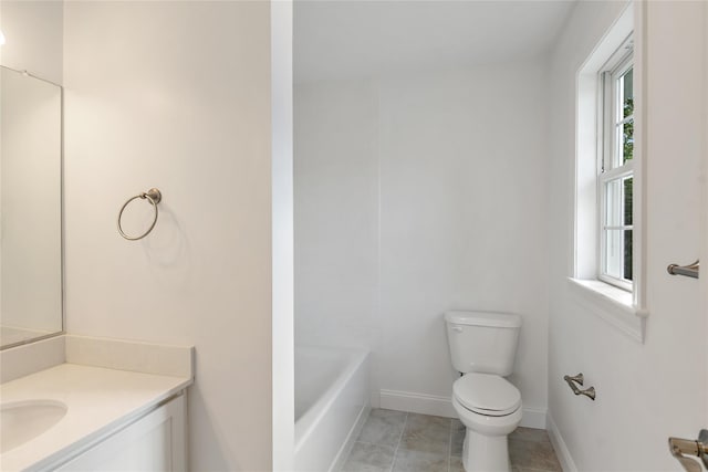 bathroom featuring tile patterned flooring, toilet, vanity, and baseboards