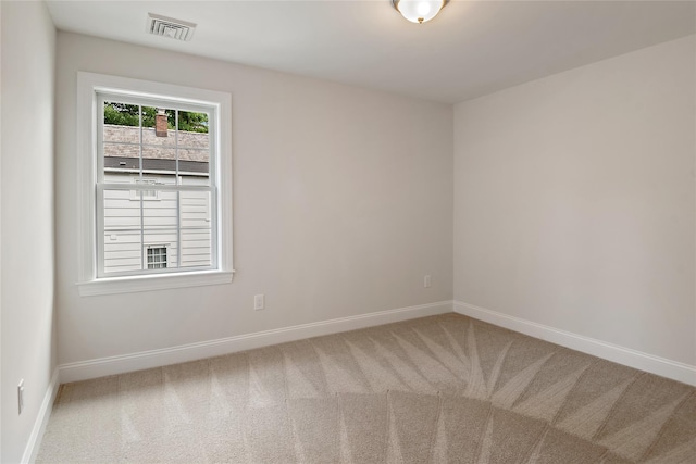 unfurnished room featuring visible vents, baseboards, and carpet floors