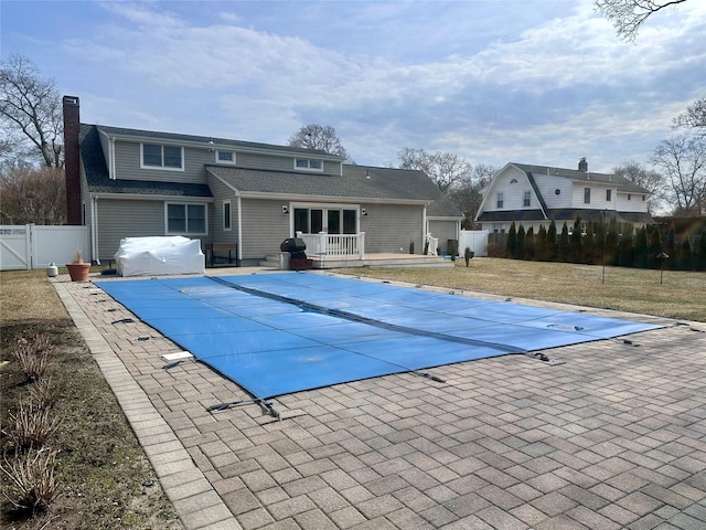 view of pool featuring a patio area, a fenced in pool, a grill, and a fenced backyard