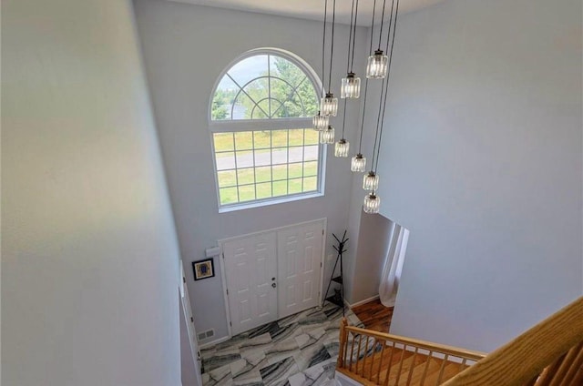 entrance foyer with visible vents and marble finish floor