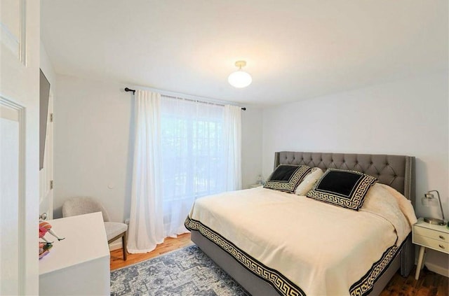 bedroom featuring wood finished floors