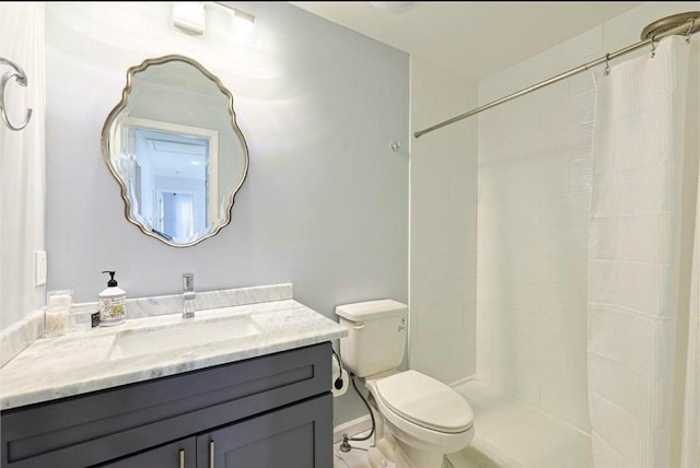 bathroom featuring vanity, toilet, and a shower with shower curtain