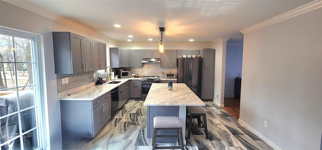 164 Lake Shore Dr E, Rock Hill, NY 12775 - kitchen featuring gray cabinetry, appliances with stainless steel finishes, under cabinet range hood, a breakfast bar area, and backsplash