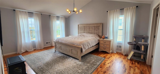 164 Lake Shore Dr E, Rock Hill, NY 12775 - bedroom with a chandelier, lofted ceiling, and light wood-style flooring