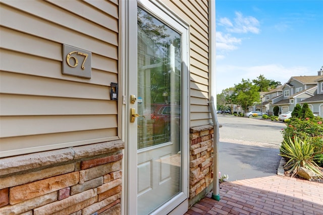 view of exterior entry with a residential view