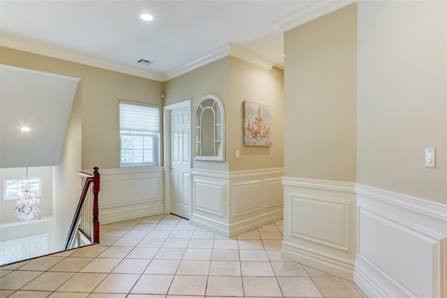 foyer with visible vents, ornamental molding, light tile patterned floors, recessed lighting, and a notable chandelier