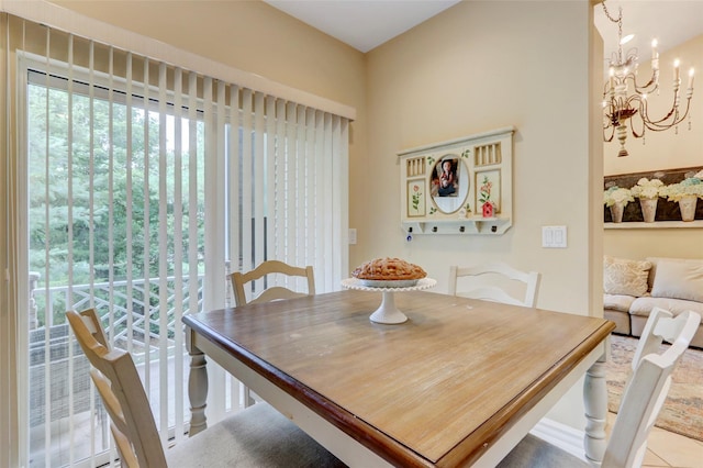 dining space with a notable chandelier