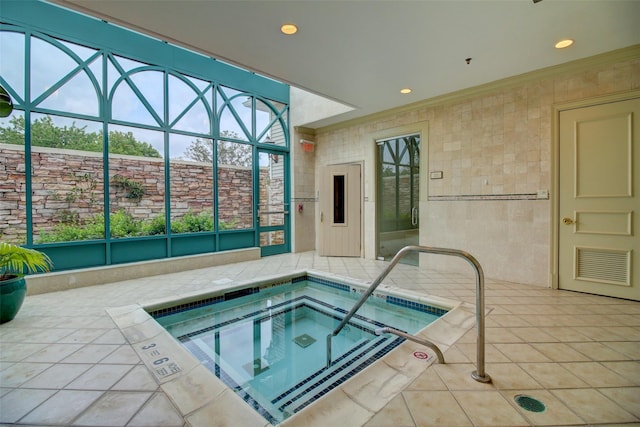 view of swimming pool with an indoor in ground hot tub