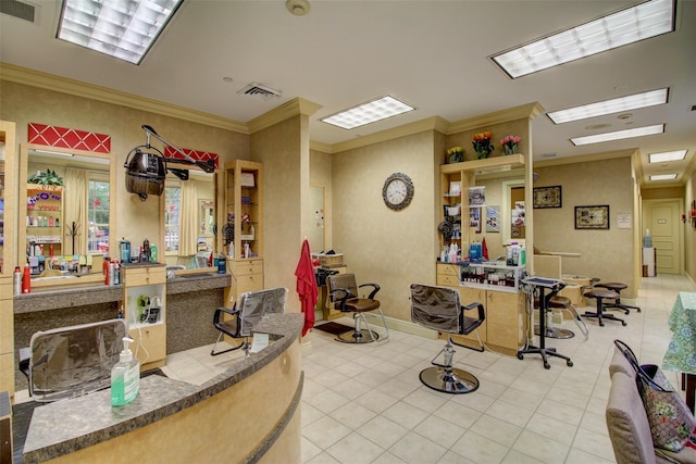 misc room with tile patterned floors, baseboards, visible vents, and ornamental molding