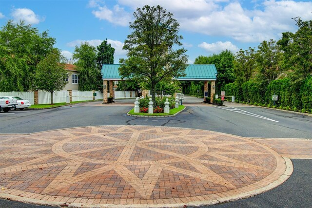 view of road with a gated entry