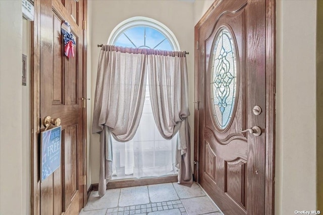 entrance foyer featuring stone tile floors