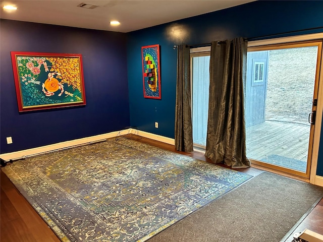 unfurnished room featuring visible vents and baseboards