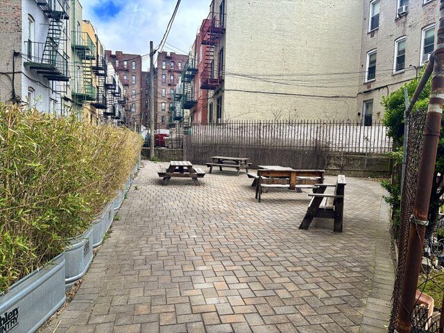 view of home's community with fence