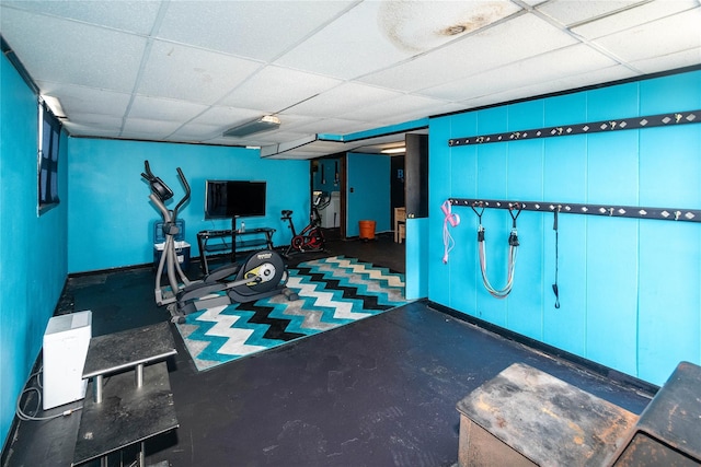 exercise room featuring a paneled ceiling