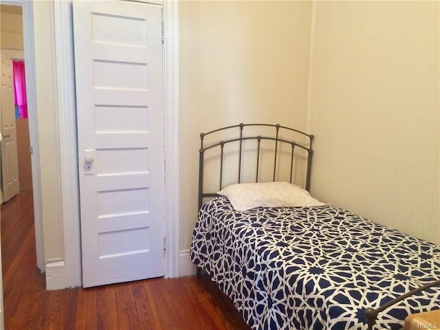 bedroom featuring wood finished floors