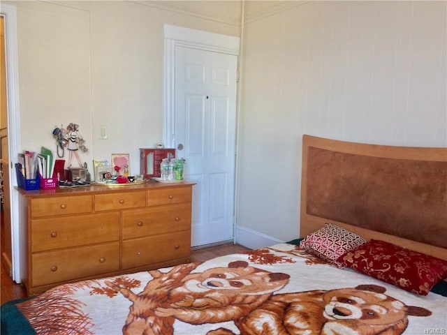 bedroom featuring wood finished floors