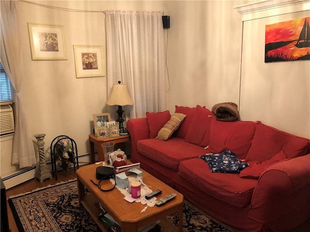 living area with a baseboard radiator and wood finished floors