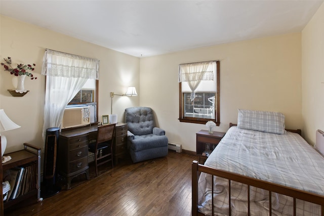 bedroom featuring hardwood / wood-style flooring, multiple windows, cooling unit, and a baseboard radiator