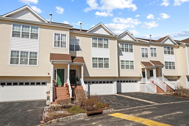 view of property with an attached garage and driveway