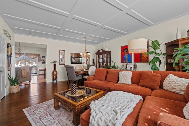 living room featuring a notable chandelier, coffered ceiling, baseboards, and wood finished floors