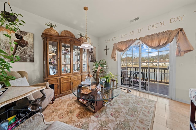 dining room with light tile patterned flooring and visible vents