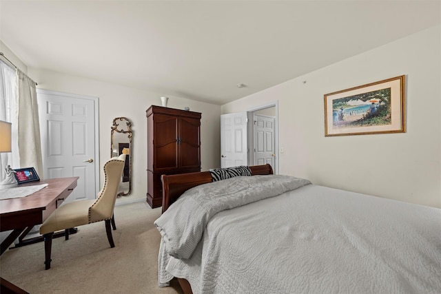 bedroom featuring light colored carpet