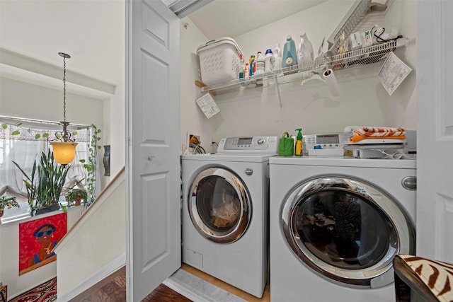 washroom with separate washer and dryer and laundry area