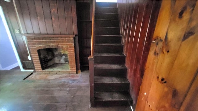 stairway with a fireplace