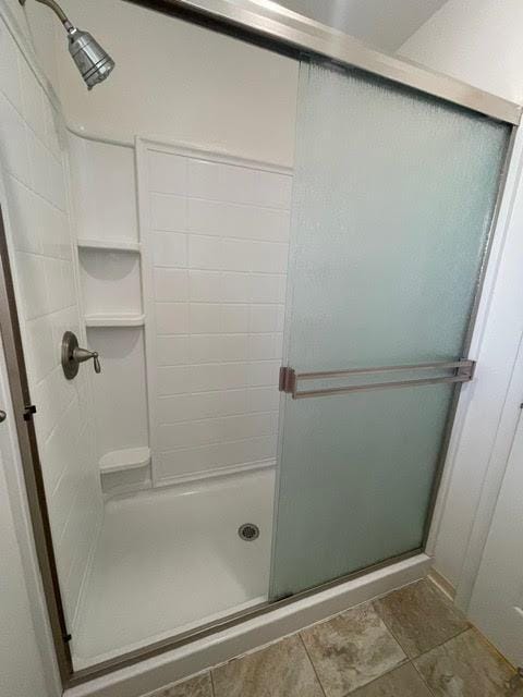 bathroom with a stall shower