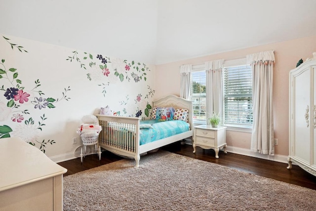 bedroom featuring baseboards and wood finished floors