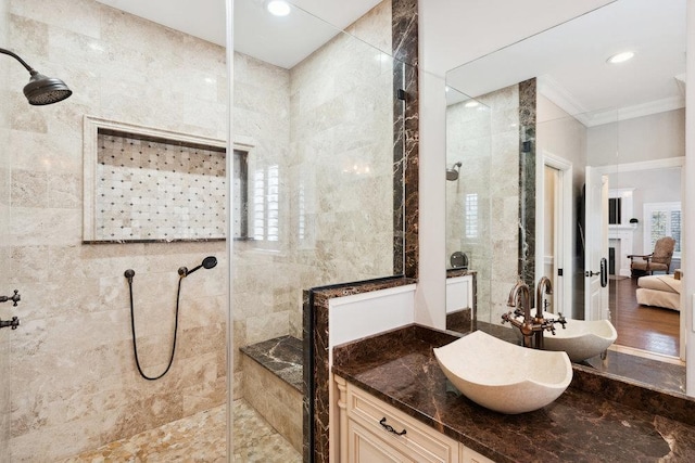 bathroom featuring connected bathroom, walk in shower, ornamental molding, recessed lighting, and vanity