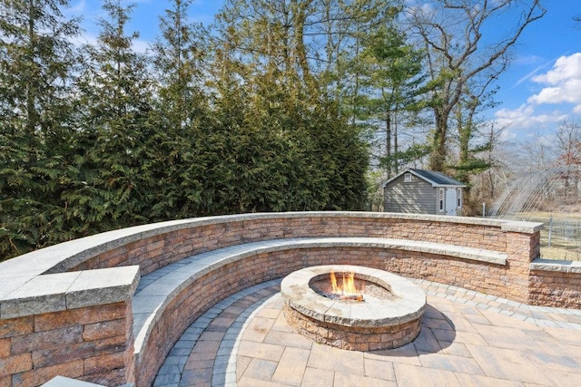 view of patio / terrace with an outdoor fire pit