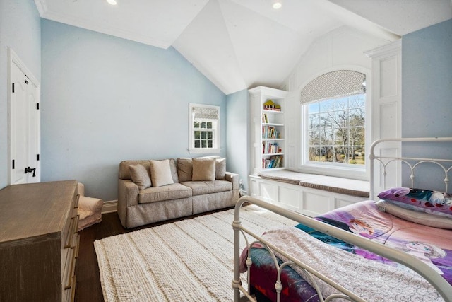 living area with lofted ceiling, dark wood-type flooring, and a wealth of natural light