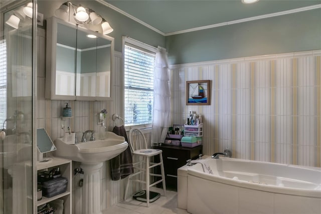 full bath featuring tile patterned floors, a garden tub, tile walls, and ornamental molding