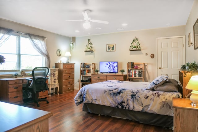 bedroom featuring ceiling fan, visible vents, and dark wood-style floors