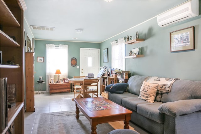 living room with a wall unit AC, light tile patterned floors, visible vents, and ornamental molding