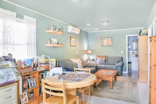 living room with an AC wall unit and ornamental molding