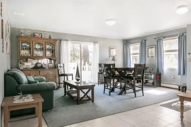 living area featuring visible vents and a baseboard radiator