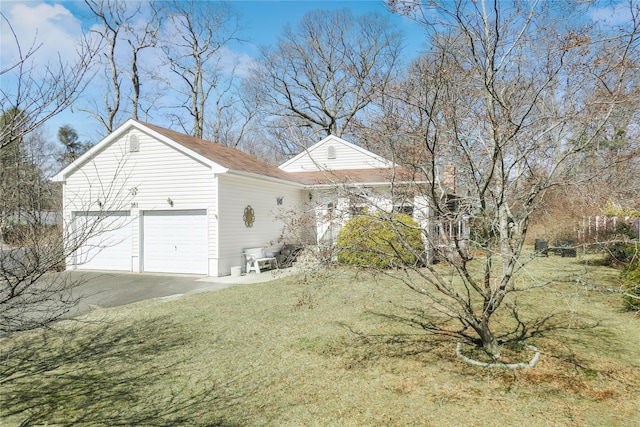 exterior space with driveway and a garage