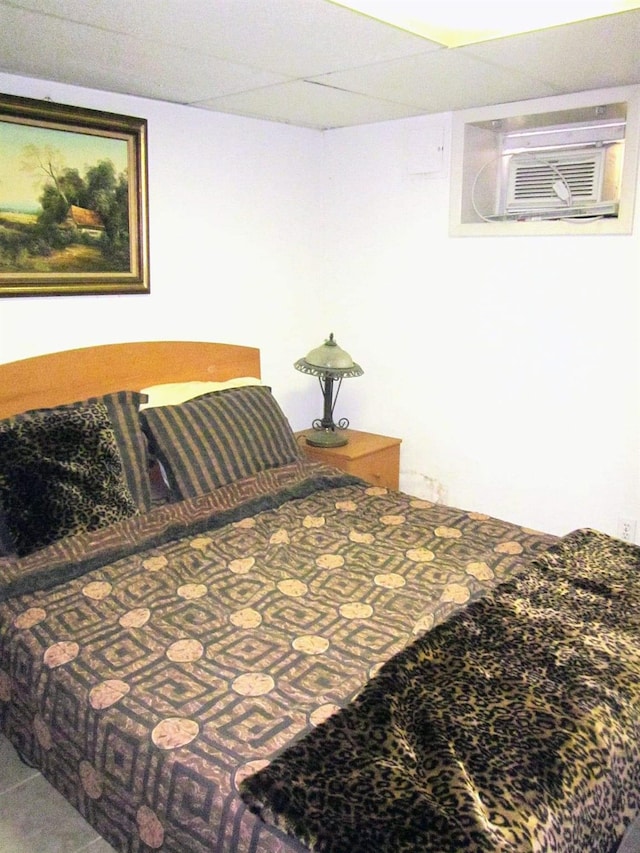 bedroom featuring a wall mounted air conditioner