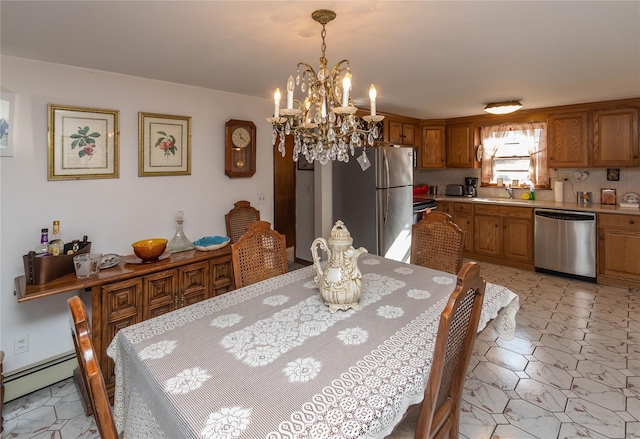 dining area with an inviting chandelier, light floors, and baseboard heating