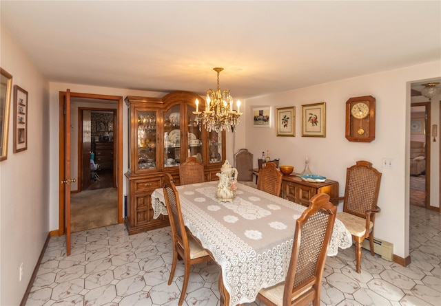 dining area featuring a baseboard heating unit, baseboards, and a chandelier