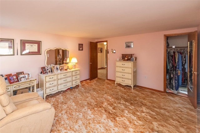 bedroom with baseboards and carpet floors